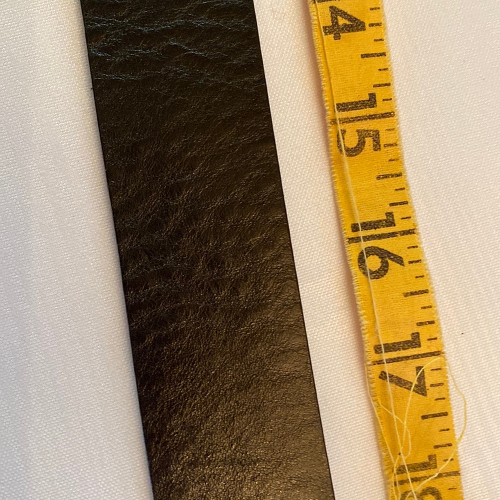 Woman’s brown leather belt with brass buckle